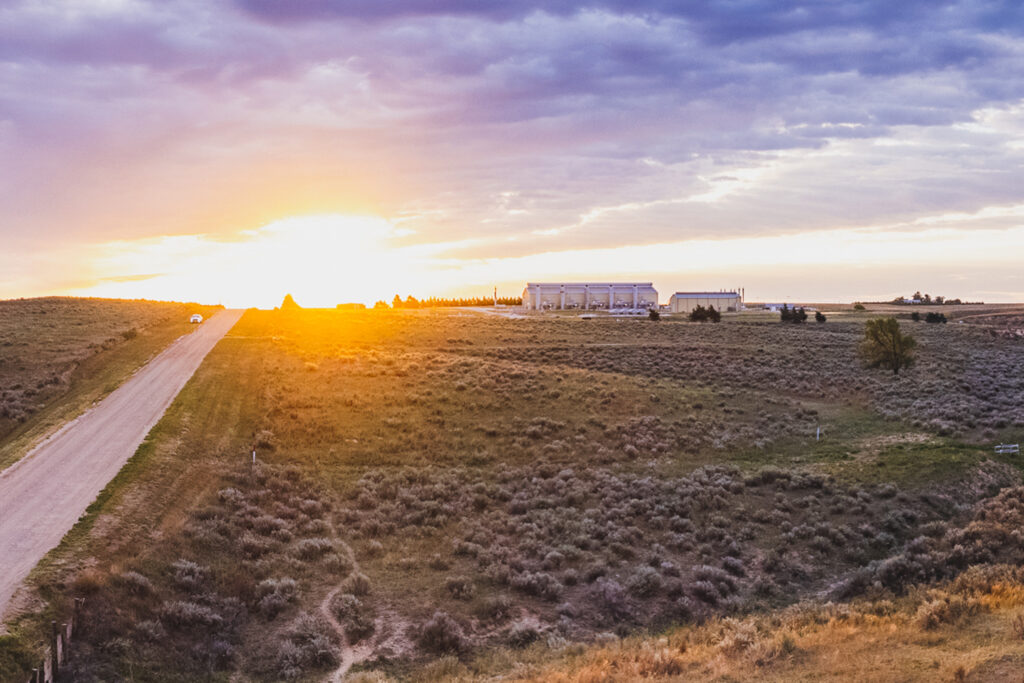 Sunrise over a field in the West
